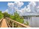 Wooden boardwalk path alongside calm water and lush foliage at 1375 Beach Rd # 210, Englewood, FL 34223