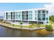 Modern condo building with pool and waterfront access at 1375 Beach Rd # 210, Englewood, FL 34223