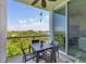 Enjoy water views from this balcony, featuring a small table and chairs at 1375 Beach Rd # 210, Englewood, FL 34223