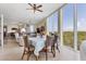 Dining area with water views and access to living room at 1375 Beach Rd # 210, Englewood, FL 34223