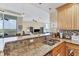 Granite kitchen island with breakfast bar and sink at 1375 Beach Rd # 210, Englewood, FL 34223
