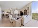 Spacious living room with tiled floors and large window at 1375 Beach Rd # 210, Englewood, FL 34223