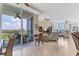 Open living space with water views and patio access at 1375 Beach Rd # 210, Englewood, FL 34223