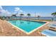 Inviting community pool with lounge chairs at 1375 Beach Rd # 210, Englewood, FL 34223