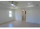 Spacious bedroom with large window and ceiling fan at 15267 Appleton Blvd, Port Charlotte, FL 33981