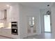 Modern kitchen with stainless steel appliances and white cabinetry at 15267 Appleton Blvd, Port Charlotte, FL 33981