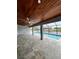 Covered lanai with wood ceiling and pool access at 15267 Appleton Blvd, Port Charlotte, FL 33981