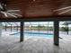 Covered lanai with pool and water view at 15267 Appleton Blvd, Port Charlotte, FL 33981