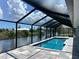 Enjoy the refreshing pool with a stunning canal view at 15267 Appleton Blvd, Port Charlotte, FL 33981