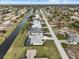 Aerial view of canal front property with a single Gathering home at 261 Broadmoor Ln, Rotonda West, FL 33947