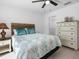 Bright bedroom with a queen bed and built-in dresser at 261 Broadmoor Ln, Rotonda West, FL 33947