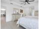 Spacious bedroom with dresser and access to kitchen at 261 Broadmoor Ln, Rotonda West, FL 33947