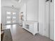 Bright and airy entryway with a white console table and barn door at 261 Broadmoor Ln, Rotonda West, FL 33947