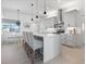 Modern kitchen featuring white shaker cabinets, a large island, and stainless steel appliances at 261 Broadmoor Ln, Rotonda West, FL 33947