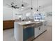 Spacious kitchen island with a farmhouse sink and stainless steel appliances at 261 Broadmoor Ln, Rotonda West, FL 33947