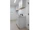 Bright laundry room with white cabinets and a built-in sink at 261 Broadmoor Ln, Rotonda West, FL 33947