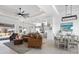 Open living room with adjacent dining area and kitchen at 261 Broadmoor Ln, Rotonda West, FL 33947