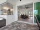 Covered patio with glass doors opening to the living room at 261 Broadmoor Ln, Rotonda West, FL 33947