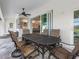 Spacious patio with a view of the pool and kitchen at 261 Broadmoor Ln, Rotonda West, FL 33947