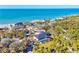 Aerial view of a beachfront home with private pool, highlighting its coastal setting at 7161 Manasota Key Rd, Englewood, FL 34223