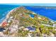 Aerial view of a waterfront home with pool, showcasing its location and luxurious features at 7161 Manasota Key Rd, Englewood, FL 34223