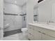 Bathroom with walk-in shower and modern vanity at 7161 Manasota Key Rd, Englewood, FL 34223