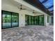 Covered lanai with tile flooring and pool view at 7161 Manasota Key Rd, Englewood, FL 34223