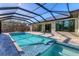 Resort-style pool and spa with screened enclosure at 7161 Manasota Key Rd, Englewood, FL 34223