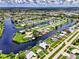 Wide aerial view of canal front community at 544 Lindley Ter, Port Charlotte, FL 33952