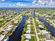 Wide aerial view of canal front homes at 544 Lindley Ter, Port Charlotte, FL 33952