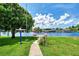 Pathway to canal-front dock with seating area at 544 Lindley Ter, Port Charlotte, FL 33952