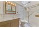 Bathroom with light wood vanity, tiled shower, and skylight at 544 Lindley Ter, Port Charlotte, FL 33952