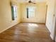 Bedroom with vinyl flooring, window, and double-door closet at 544 Lindley Ter, Port Charlotte, FL 33952