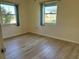 Bright bedroom with vinyl flooring and two windows at 544 Lindley Ter, Port Charlotte, FL 33952