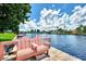 Pink bench on wooden dock overlooking canal at 544 Lindley Ter, Port Charlotte, FL 33952