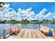 Wooden dock with pink chairs overlooking canal at 544 Lindley Ter, Port Charlotte, FL 33952