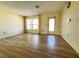 Living room with vinyl flooring, window, and exterior door at 544 Lindley Ter, Port Charlotte, FL 33952