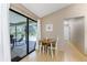 Bright dining area with view of pool and sliding glass doors at 7293 Spinnaker Blvd, Englewood, FL 34224