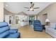 Living room with vaulted ceiling and view of kitchen at 7293 Spinnaker Blvd, Englewood, FL 34224