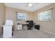 Home office with window and neutral carpeting at 7293 Spinnaker Blvd, Englewood, FL 34224