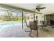 Inviting pool area with patio furniture and screened enclosure at 7293 Spinnaker Blvd, Englewood, FL 34224