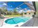 Inviting pool and spa with screened enclosure at 7293 Spinnaker Blvd, Englewood, FL 34224