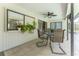 Relaxing screened patio with seating area and potted plants at 7293 Spinnaker Blvd, Englewood, FL 34224