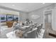 Dining room with modern furniture, statement decor, and plenty of natural light from an adjacent sunroom at 740 Summersea Ct, Englewood, FL 34223