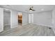 Main bedroom features vinyl plank flooring and is next to the en-suite bathroom and large walk-in closet at 740 Summersea Ct, Englewood, FL 34223