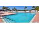 Community pool with plenty of lounge chairs at 740 Summersea Ct, Englewood, FL 34223