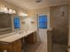 Accessible bathroom with walk-in shower and dual sinks at 881 Bayshore Dr, Englewood, FL 34223