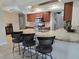 Kitchen with granite countertops and breakfast bar at 881 Bayshore Dr, Englewood, FL 34223