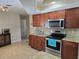 Kitchen with granite countertops and stainless steel appliances at 881 Bayshore Dr, Englewood, FL 34223