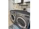 Laundry room with LG washer and dryer, and additional storage at 881 Bayshore Dr, Englewood, FL 34223